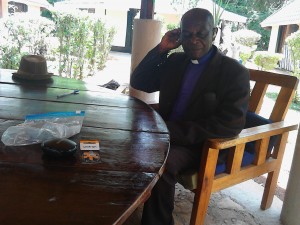 Rev.Bwayo trying the aids